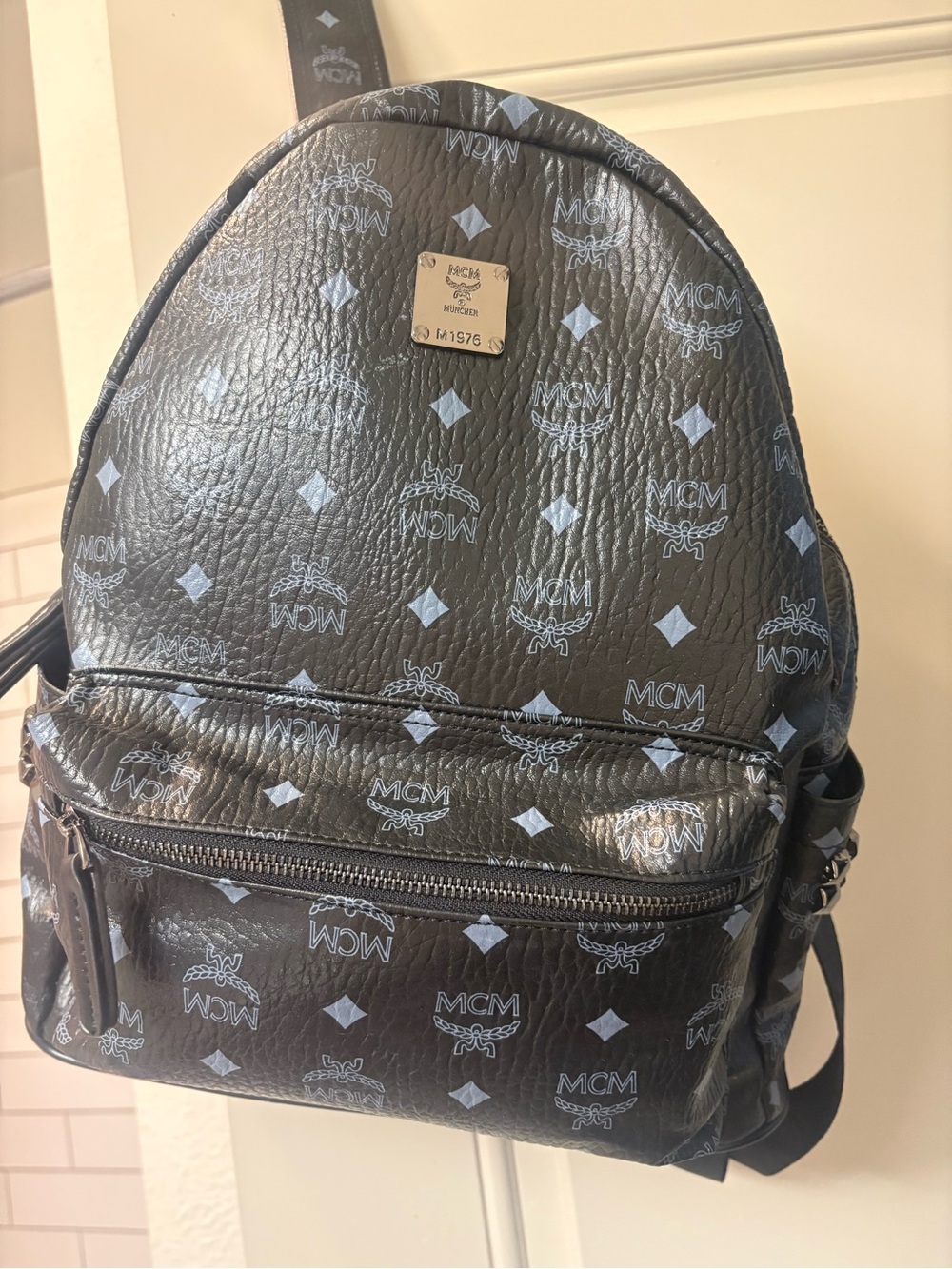 Black Logo-Print Leather Backpack with Silver Plaque